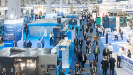 Trade show aisle with laundry equipment booths